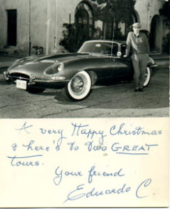 Eduardo Caso with his car, handwritten on picture it reads "A very Happy Christmas and here's to two great tours. Your friend, Eduardo C".