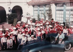 A group photo of choristers and Eduardo Caso