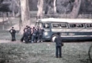 Group of boys pushing a bus